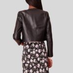 "Side view of cropped black leather jacket"