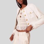 "Front view of cropped white leather jacket"