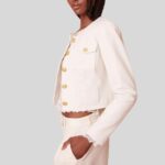 "Side view of cropped white leather jacket"