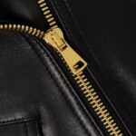 Close-up of cropped leather biker jacket detail