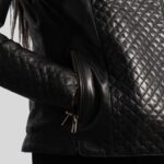 Close-up of the black quilted pattern on a biker jacket for women