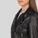 Close-up of women's black leather biker jacket detailing