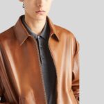 Side view of men's brown leather bomber jacket